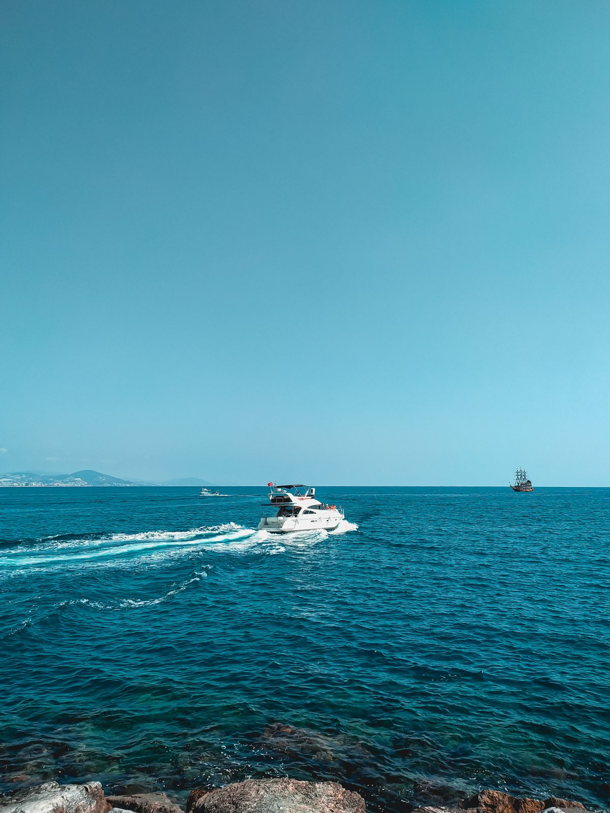 A boat crossing open blue water